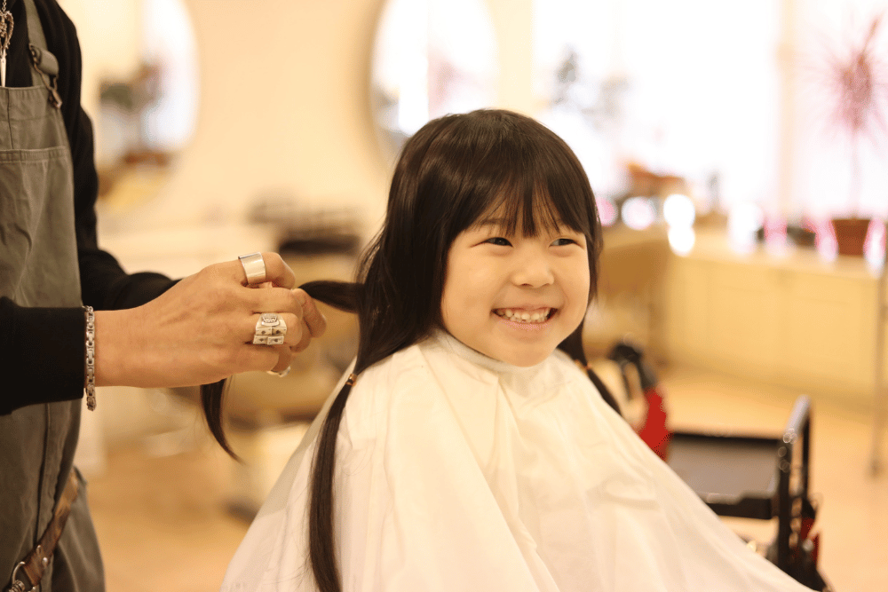 Girl getting a haircut in San Antonio