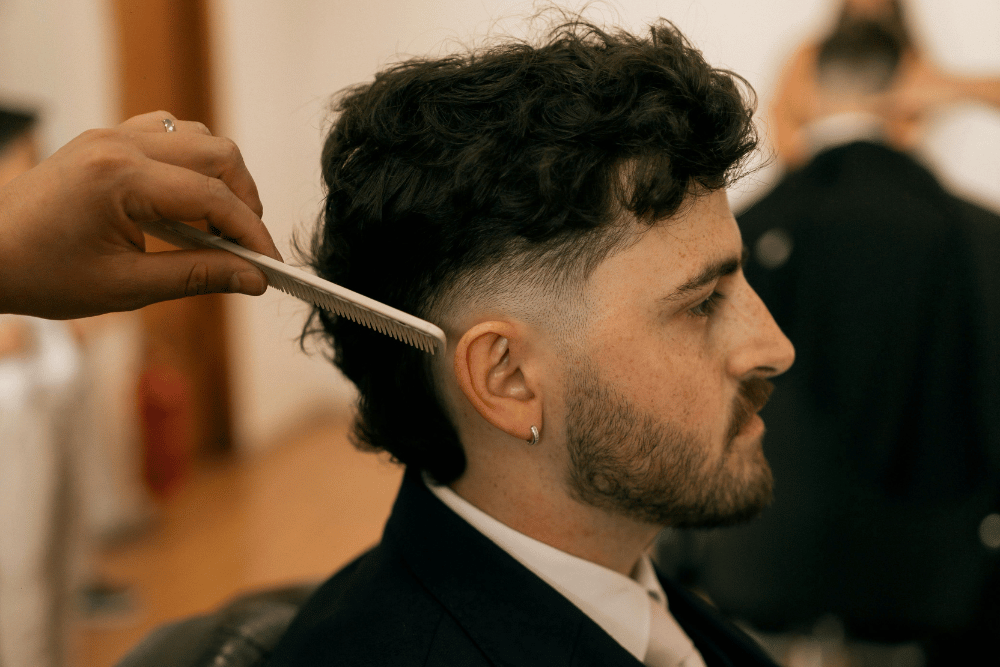 Man getting haircut at hair salon in San Antonio